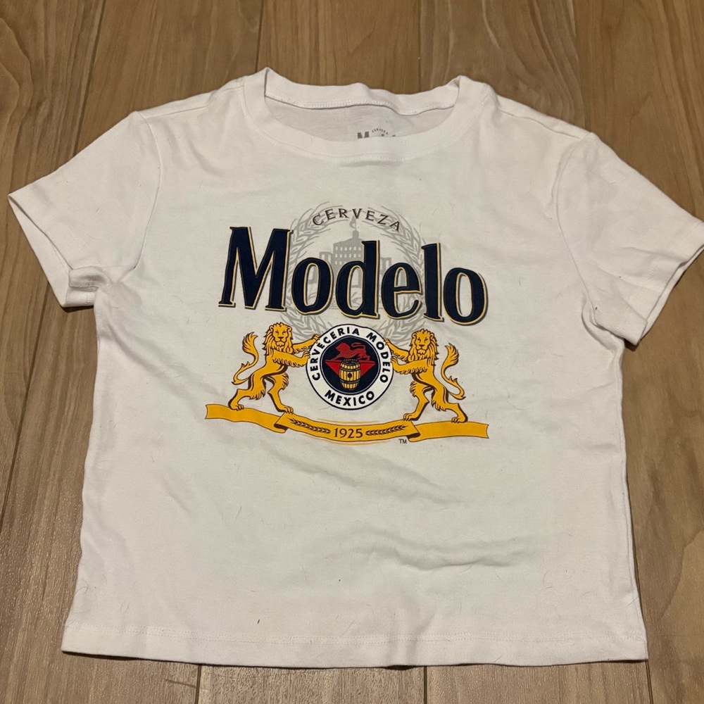 Modelo Cerveza White and Gold Baby Tee